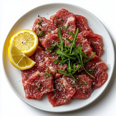 Fototapeta premium Top view of a juicy Carpaccio, Raw Meat, Lemon on big plate, The white plate is perfectly are arranged neatly, all captured against a pure white background