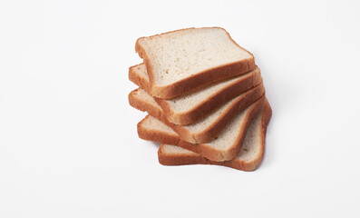 A stack of bread slices on a white background. The bread slices are all the same size and stacked on top of each other. Ecologically clean product.