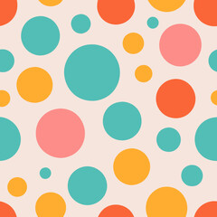 A playful, retro-inspired pattern featuring large, colorful dots in a random but balanced arrangement, with colors like turquoise, coral, and yellow on a pale pink background