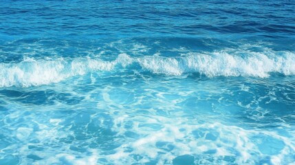 Fototapeta premium Pure blue turquoise water texture of the ocean sea with foam from and waves