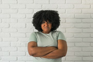 Portrait of young african american woman with frowning expression