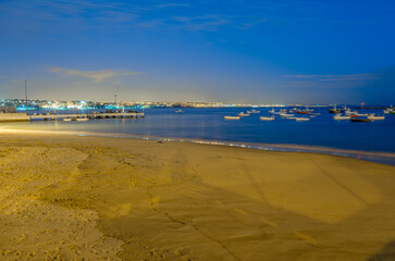 Boats seen at night in Cascais, Portugal
