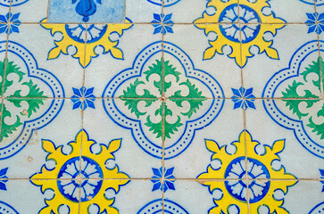 Colorful ceramic tiles on building facades in the old town of Lisbon, Portugal