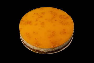 Orange cheesecake isolated on a white background.