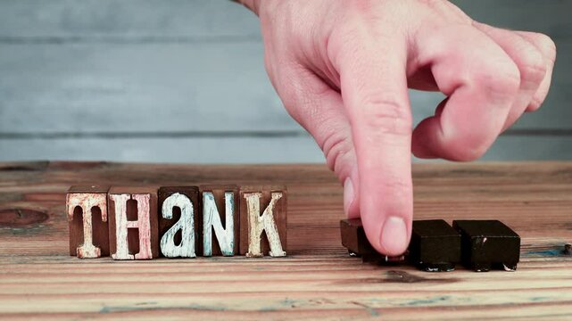Thank You. Gratitude and hospitality. Spelling word using wooden alphabet blocks