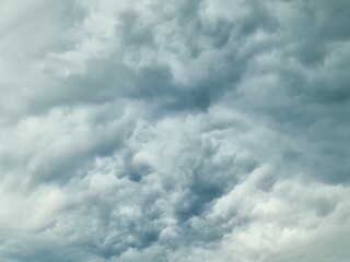 The heavens darken as a mass of storm clouds builds before a thunderstorm.
