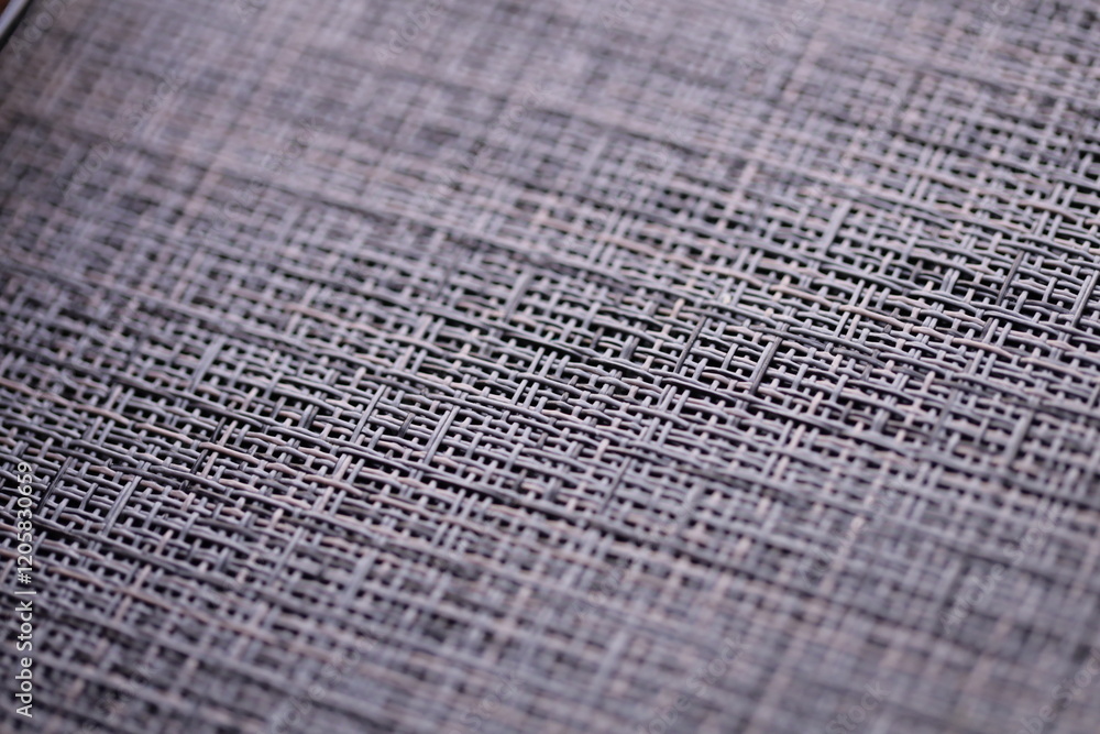 Poster a close-up view of a piece of cloth with intricate design.