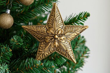 Ornate Gold Star Christmas Ornament on Artificial Tree