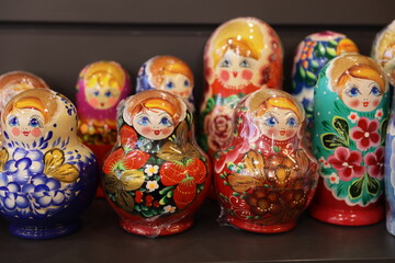 Colorful Russian nesting dolls on a shelf, decorative display.