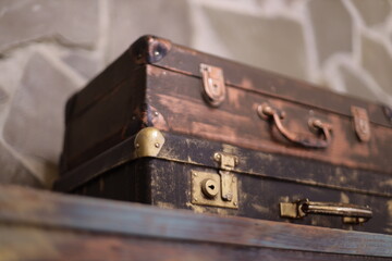 Two vintage suitcases stacked on top of each other.