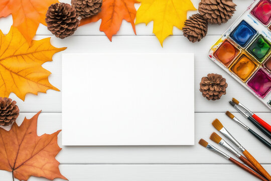 A white canvas is surrounded by vibrant autumn leaves and pine cones. Hobbies and Leisure Activities: Add color and fun to your days.