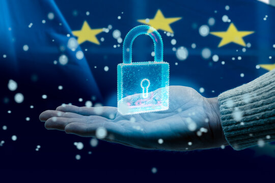 Hand holding hologram of padlock protecting european union data privacy - Powered by Adobe