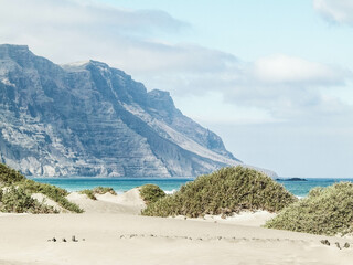 Beach and mountains - beautiful coast in Caleta de Famara, Lanzarote Canary Islands.