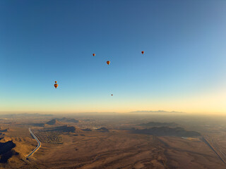 Aerial view from several hot air balloons in flight showing panoramic view of Phoenix Arizona