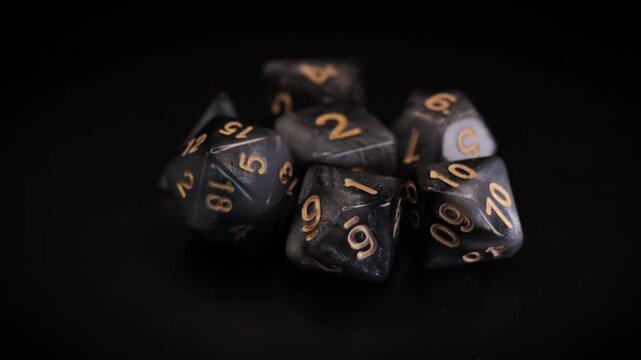Fantasy RPG gray Dice set isolated 360 rotation black background