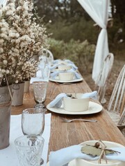 Country chic table setting, gathering, chairs, trees, lunch, canopy.