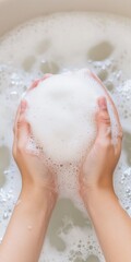 Fototapeta premium Hands Holding Foamy Soap in Soapy Water Cleanliness and Hygiene Concept