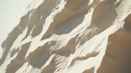 Obraz premium Sunlit sand dune texture, desert landscape background, nature photography, design element