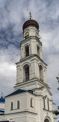 Obraz premium Bell tower and archangel Michael church above the gate, years of construction 1889 - 1903. Nativity of the Virgin monastery, village Raifa, Russia