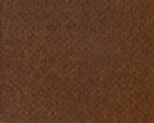 Surface of an old brown paper or cardboard, background, texture. Backdrop of dark-brown rough paper surface with elements of aging. Old brownish paper piece. Chocolate, porous, faded paper