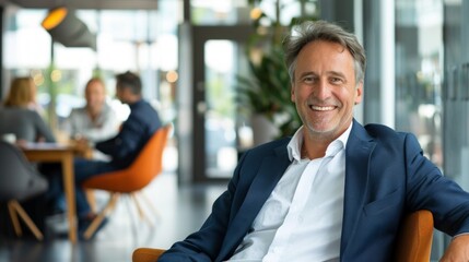 Smiling man in a business suit sitting in a cafe. Great for corporate websites, advertising business services and career articles.