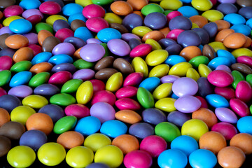 Colorful candy collection scattered across a vibrant background