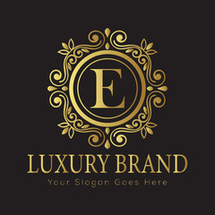 Luxury Ornate Letter Logo with Floral Frame and Dots

