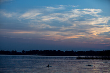 A Serene Evening by the Water with an Exquisitely Colorful Sky that Captivates the Senses