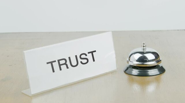 Trust Office or Room with Hand Ringing The Bell on Desk or Table Multiple Times