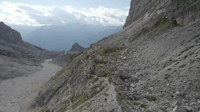 Aerial footage of Sentiero Alfredo Benini from Castelletto Superiore to Rifugio Tuckett e Sella in the Brenta Dolomites, featuring rugged limestone cliffs, exposed ridges, and scenic alpine landscapes