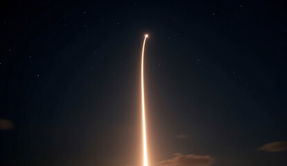 Spacecraft launch captured with a radiant trail across a dark horizon
