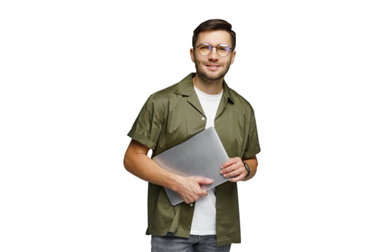 Young man holding a laptop standing confidently against a white background
