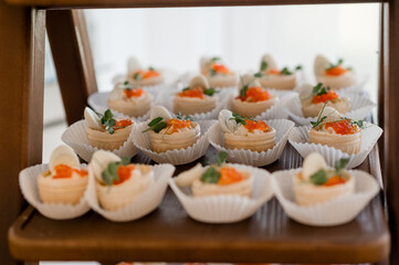 Wedding table with snacks, ham, crayfish and salads