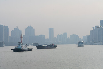 Fototapeta premium Cargo ships on the Huangpu River in Shanghai, China