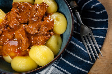 Beef stew in gravy, served with silesian dumplings.