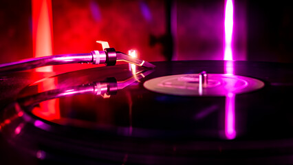 Needle detail on vinyl record on turntable, low light image with reflection