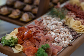 Wedding table with snacks, ham, crayfish and salads