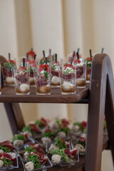 Wedding table with snacks, ham, crayfish and salads