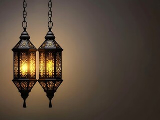 Two Illuminated Ornate Lanterns Hang From Chains