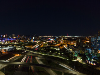 Fototapeta premium Minneapolis night skyline with highway and river
