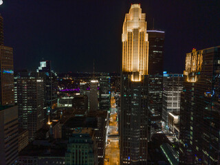 Aerial night view of Minneapolis, Minnesota, featuring glowing skyscrapers