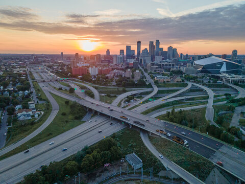 Aerial shot of downtown Minneapolis, Minnesota,  featuring highway interchange at sunset