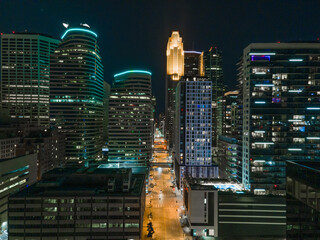 Aerial night view of Minneapolis, Minnesota, featuring glowing skyscrapers