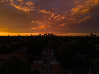 Aerial view of Minneapolis, Minnesota, at sunset with a dramatic sky