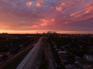 Aerial view of Minneapolis, Minnesota, at sunset with a dramatic sky