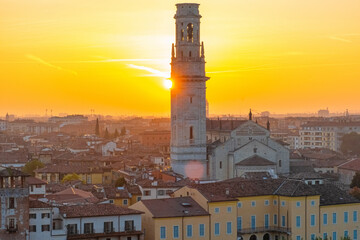 Obraz premium View of Verona old town with bell tower of Verona Cathedral, medieval architecture at sunset, Veneto, Italy. Italian cityscape. Travel destination in Europe