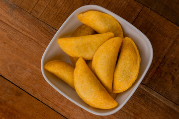 Delicious traditional Colombian empanadas with spicy sauce