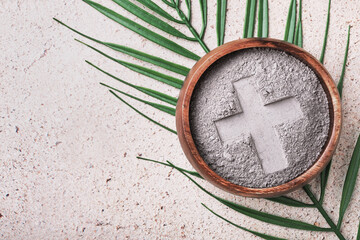 Ash wednesday background with cross in ashes and palm leaf