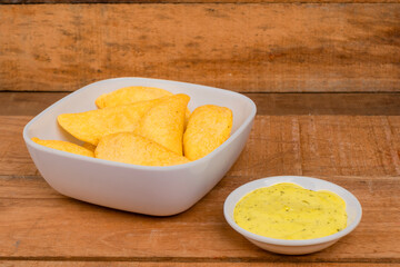 Delicious traditional Colombian empanadas with spicy sauce