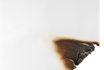 Burnt paper scrap isolated on white background, top view